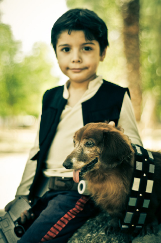 Illustration for article titled The most adorable Han Solo and Chewbacca are this kid and his dog